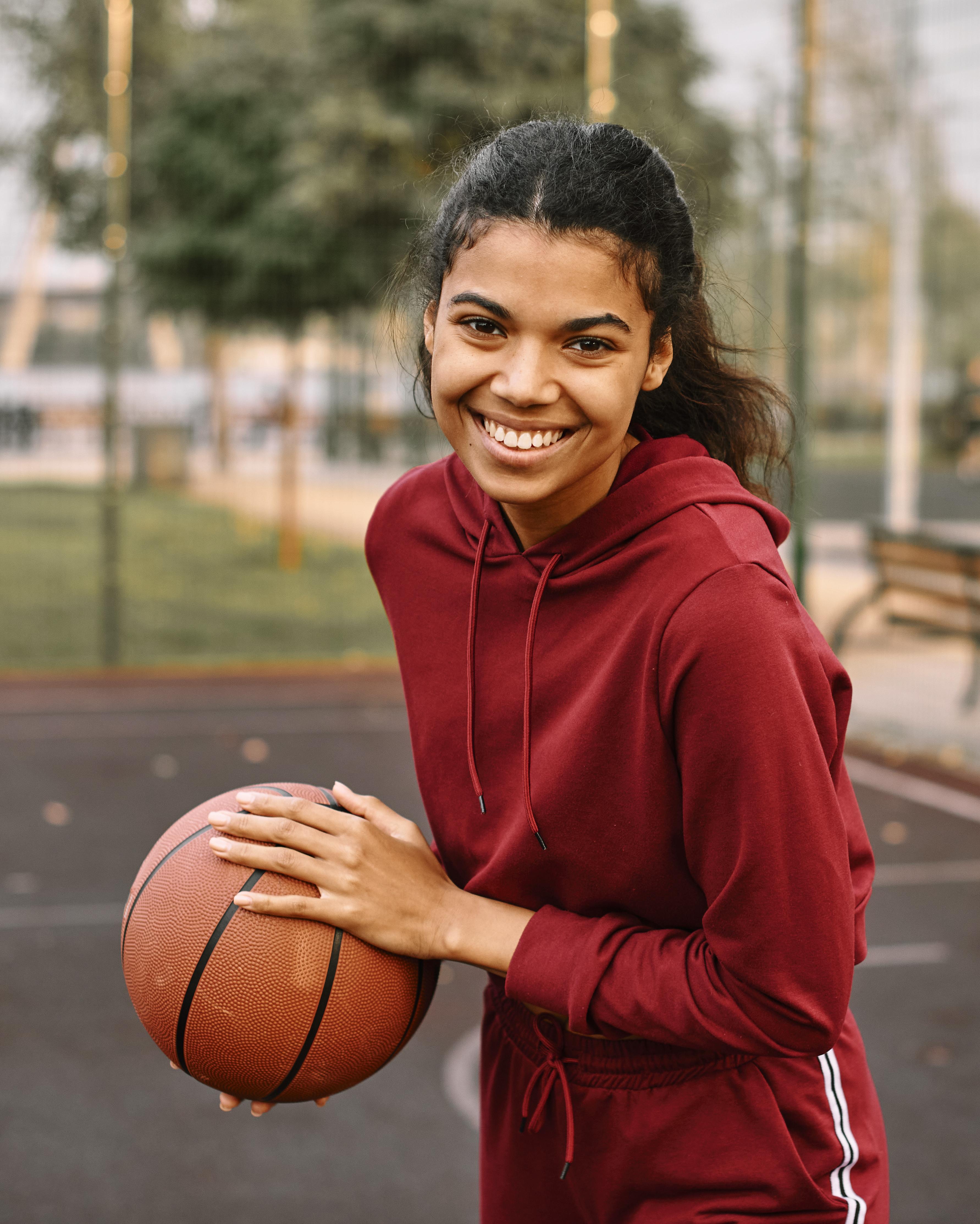 black-american-woman-holding-basketball